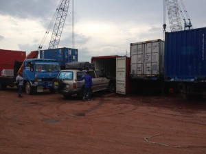 Cars being loaded into containers at Batam 2