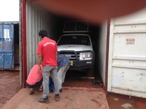 Cars being loaded into containers at Batam 8 