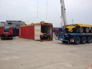 Cars being taken from container and placed on tow trucks in Singapore & trucked to Malaysian border 1 