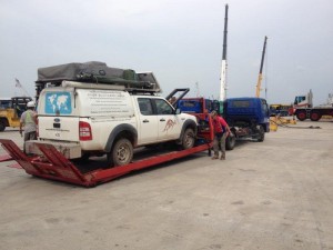 Cars being taken from container and placed on tow trucks in Singapore & trucked to Malaysian border 5 