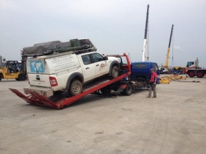 Cars being taken from container and placed on tow trucks in Singapore & trucked to Malaysian border 7 