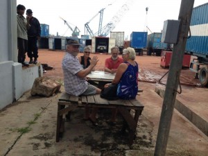 Playing cards with locals at Batam port 